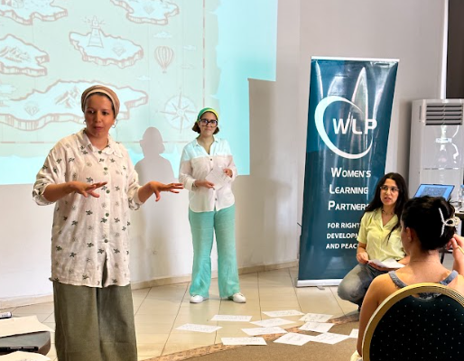 Participants of ADFM's Leadership Development Program on the Culture of Democracy presenting in front of a group