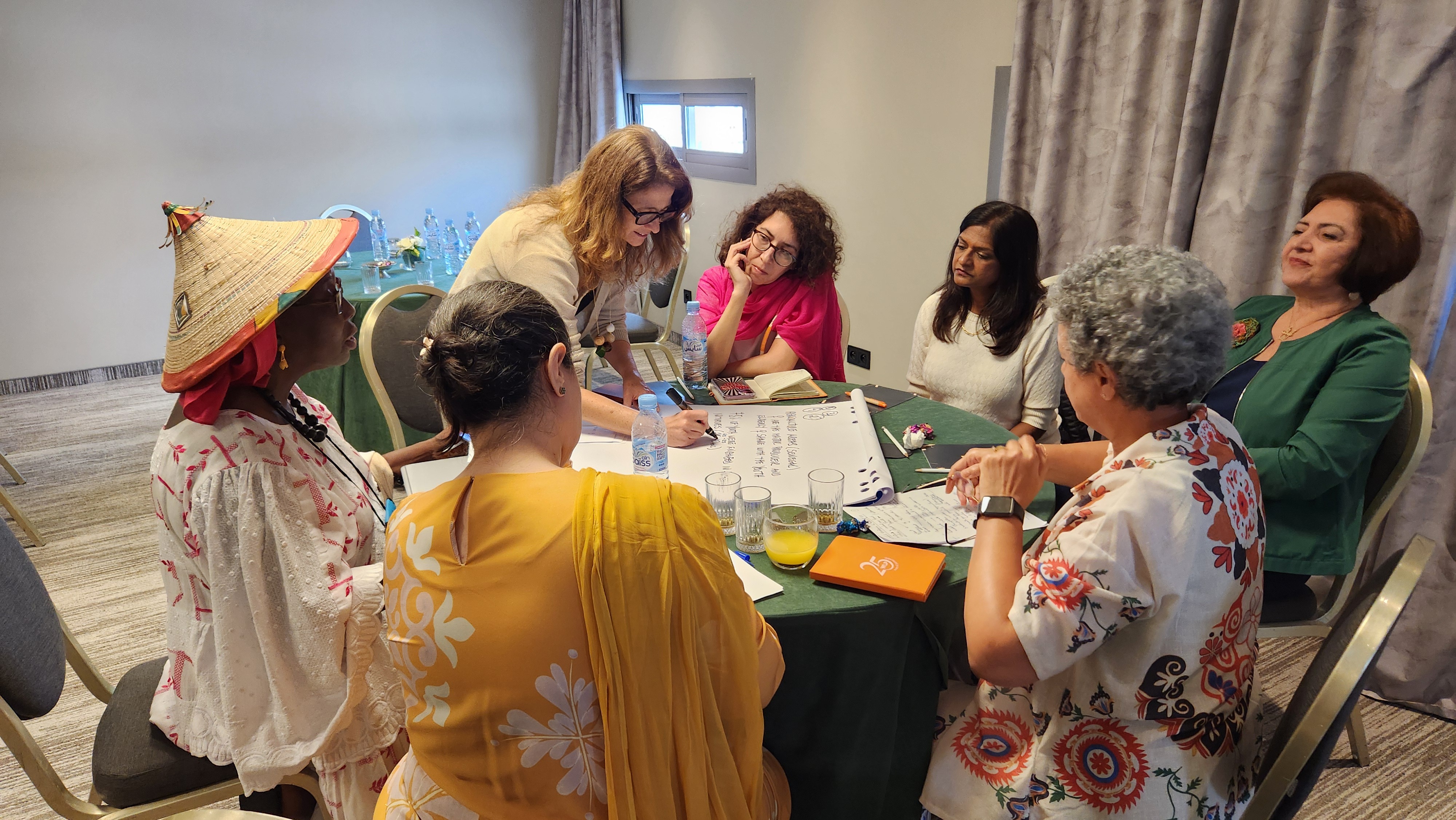 Women from across the Global South discussing climate leadership