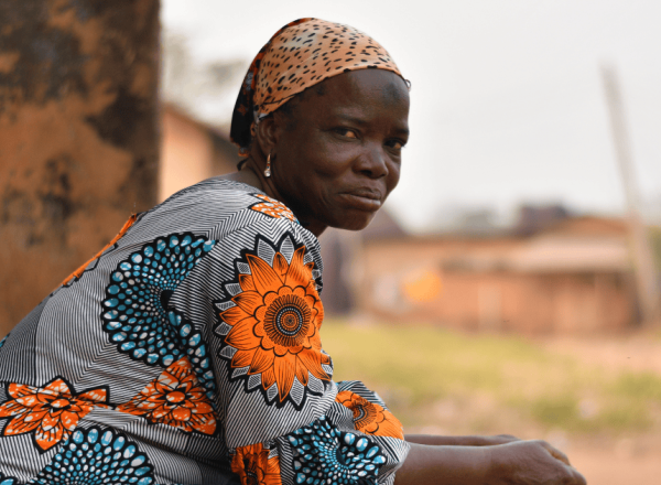 Nigerian Woman outside her home